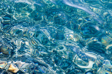 Shine of blue sea water. Natural blurred background. Toned