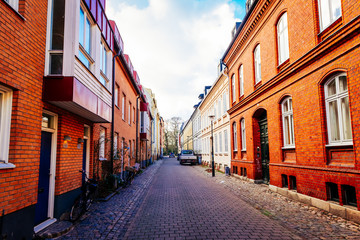 Fototapeta na wymiar Street with old nice colorful houses in historical center of Malmo, Sweden