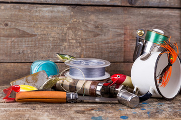 fishing tackles, baits, line with flask, knife and white metal c