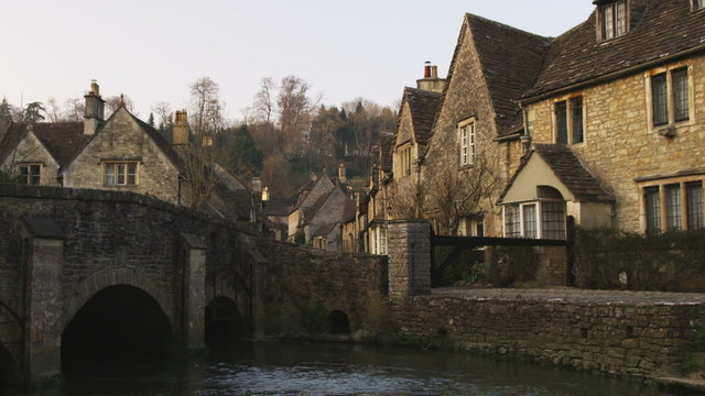 Shot of an old stone village bridge and stream in England.