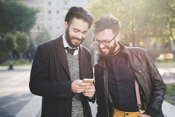 Half length of two young handsome caucasian bearded brown hair b
