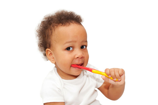 Black baby toddler brushing teeth.