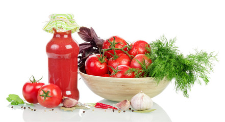 Cooked ketchup and fresh tomatoes with spices on a white backgro