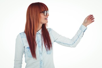 Smiling hipster woman pointing something