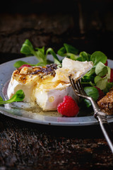 Baked Goat cheese with honey and raspberries