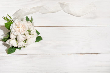 bunch of white roses on white table like frame for photo .top vi
