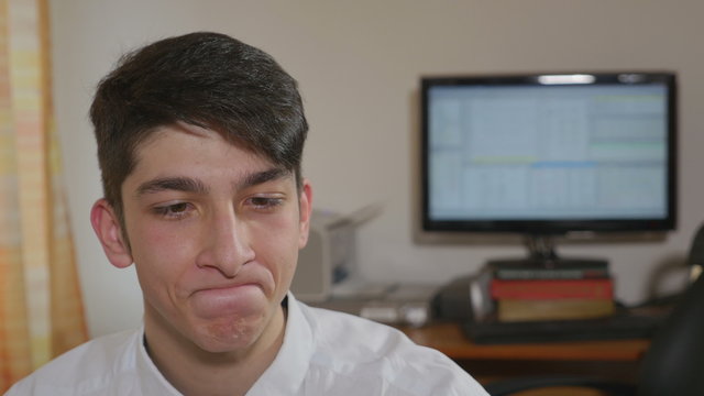 Young handsome businessman making funny faces