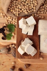Fototapeta na wymiar Tofu for cooking and soybean seed.