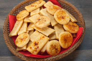 Homemade salty crackers with red paprika on top