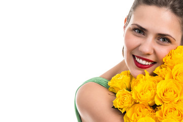 Portrait of beautiful cheerful woman with a bouquet of roses