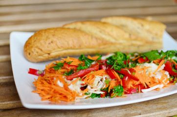 fresh baguette sandwich with carrot salad.vegan food