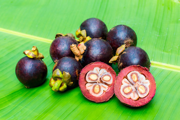 Fresh mangosteen on banana leaf