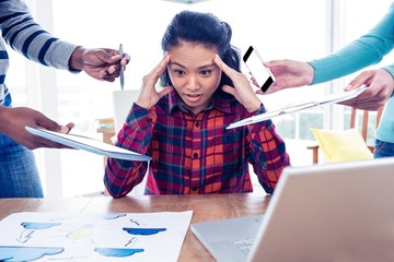 Stressful businesswoman looking down