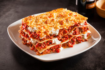 Tomato and ground beef lasagne with cheese - obrazy, fototapety, plakaty