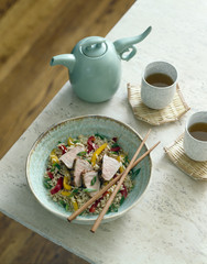 Asian tea with pork and rice.