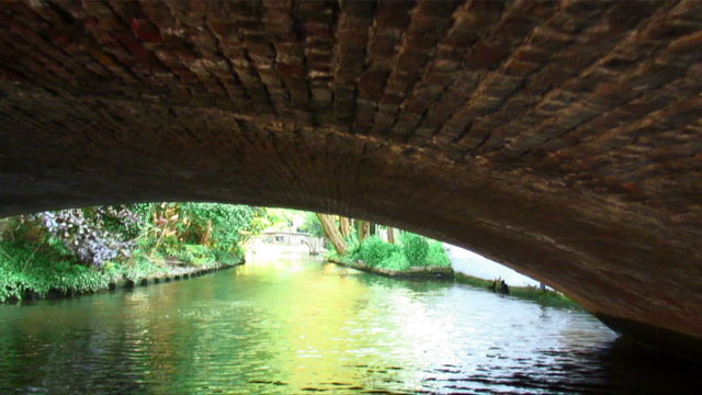 Going under a bridge on a canal in Brugge, Belgium.