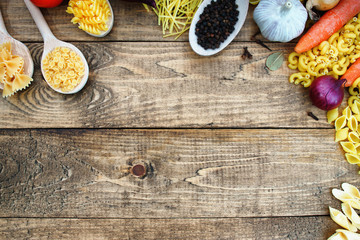 Pasta with fresh vegetables on the table