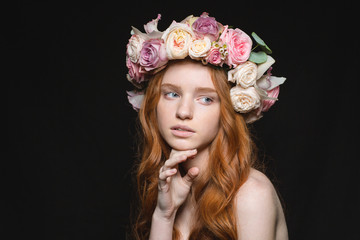 Redhead woman with wreath from flowers on head