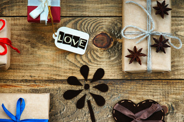 Gift boxes, heart shape and label with word Love