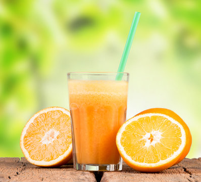 Fresh orange juice on woden table 
