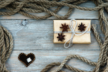 Frame made of rope, gift box and heart shape