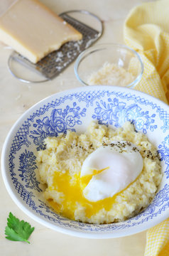 Millet Porridge with Poached Egg and Grated Cheese