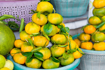 Fresh exotic tropical fruits for sale at an outdoor market.