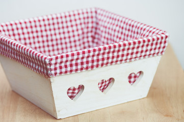 wood basket with checkered fabric lining