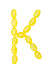 K letter made of colors candy