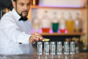Barman at work, preparing cocktails.