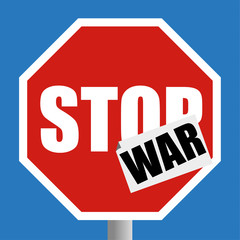 Conventional red and white road traffic Stop sign with a sticker of the word WAR added as an peace protest concept