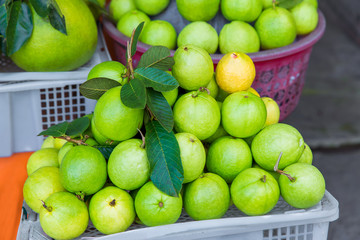 Fresh exotic tropical fruits for sale at an outdoor market.