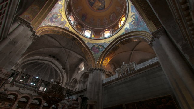 Panning shot of Low-angle time lapse of room in Church of the Holy Sepulchre