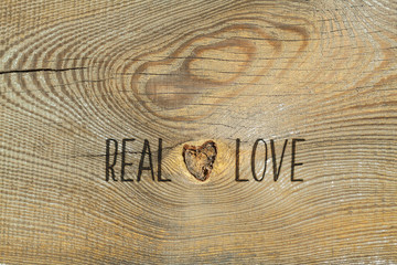 Love. Romantic card with natural wooden background 