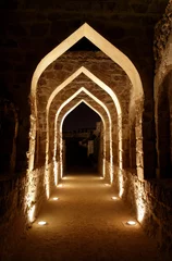 Foto op Plexiglas Vestingwerk Illuminated passage inside Bahrain fort
