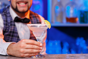 Barman at work, preparing cocktails.