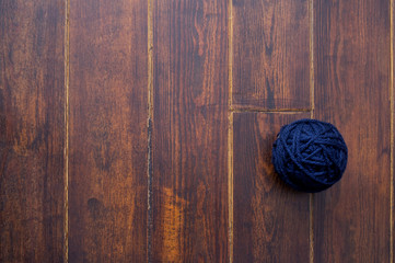 Dark navy skein over wooden background