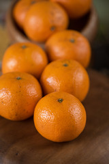 tangerines on wooden background