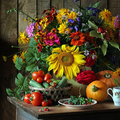 Naklejka na ściany i meble Still life with autumn flowers and vegetables.