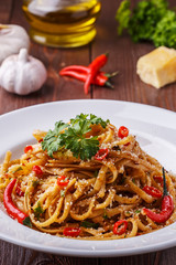 Homemade linguine pasta in arrabbiata sauce.