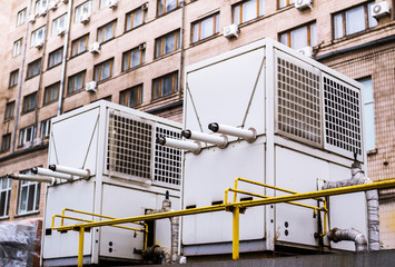 Air conditioning and water heating chillers for big buildings