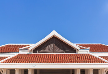 red rooftop against blue sky