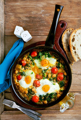 frittata with tomatoes, spinach, chickpeas, eggs, zucchini and f