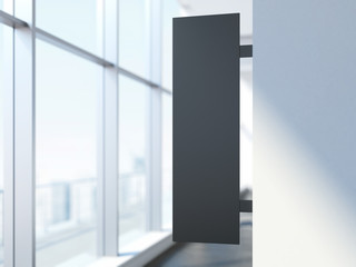 Black vertical signboard in the office interior