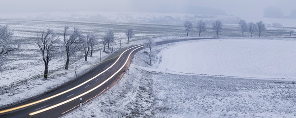 winter landscape with car's traces in Czech Republic