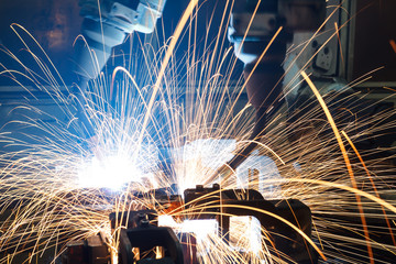 robots welding in a car factory