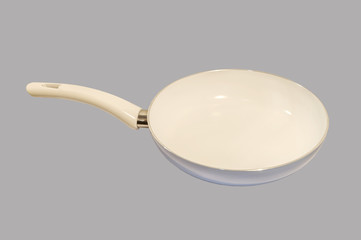 Frying pan isolated on grey background