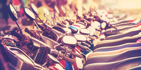 Vintage stylized picture of scooters in a row.