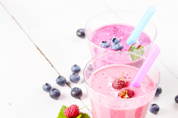 Assorted fruit shakes on white table