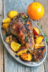 Dish with roasted turkey thigh. View from above.